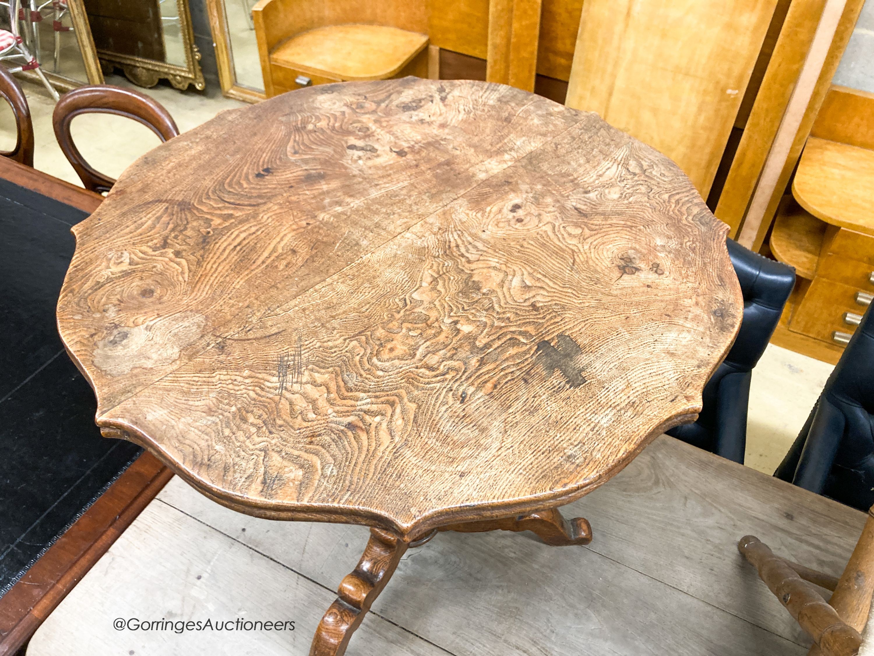 An early 20th century circular oak tripod table, W.67cm H.69cm